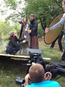 Kate adjusts Sophie's bow as the crew prepare to shoot a close-up.