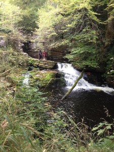 Christopher Dane (Karn) and Sophie rehearse beside the picturesque waterfall.